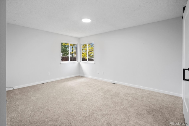 2090 S Fairplay St, Aurora, CO 80014 - carpeted spare room with baseboards and a textured ceiling