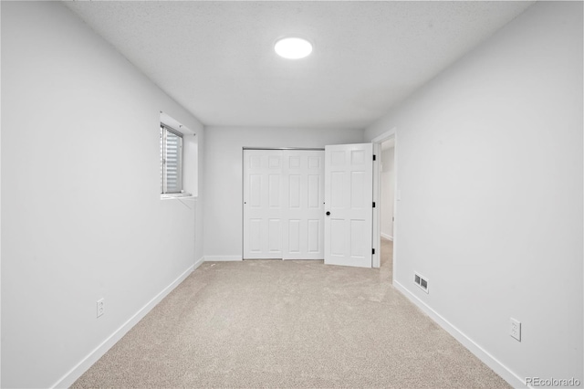 2090 S Fairplay St, Aurora, CO 80014 - unfurnished bedroom with carpet flooring, baseboards, and a closet