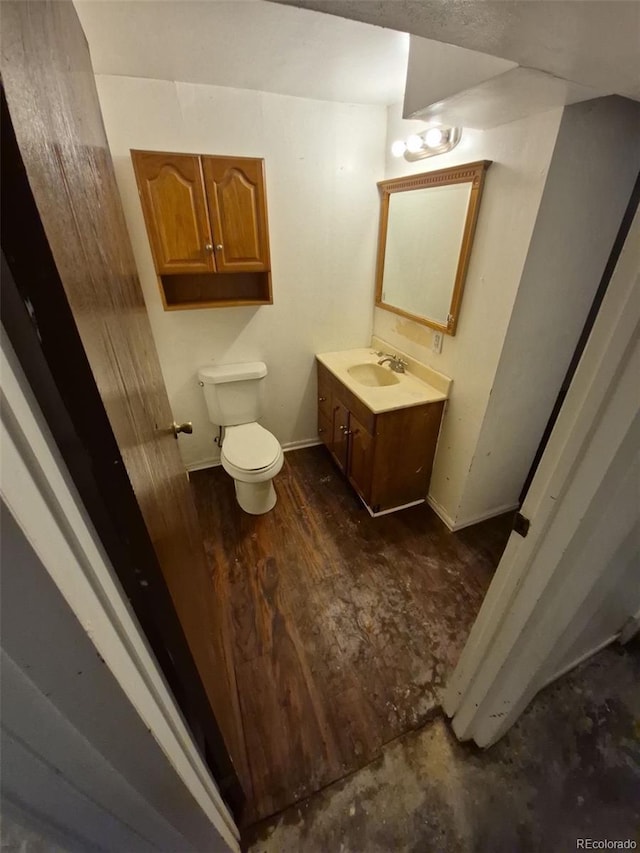 3984 S Pitkin Way, Aurora, CO 80013 - half bathroom with vanity, toilet, and baseboards