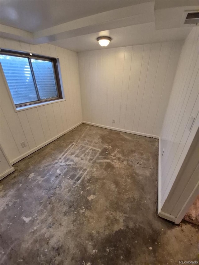3984 S Pitkin Way, Aurora, CO 80013 - spare room with wooden walls and unfinished concrete flooring
