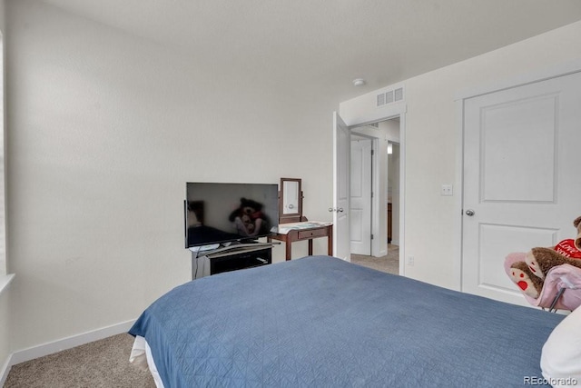 21821 E 7th Ave, Aurora, CO 80018 - bedroom with baseboards, light carpet, and visible vents