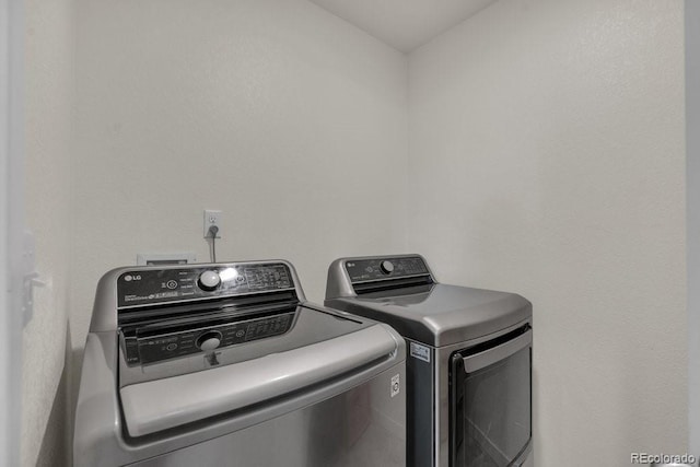 21821 E 7th Ave, Aurora, CO 80018 - laundry room featuring separate washer and dryer and laundry area