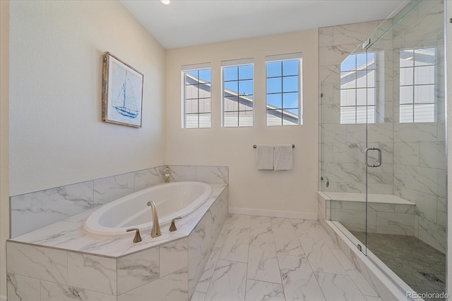 full bath featuring a garden tub, baseboards, a stall shower, and marble finish floor