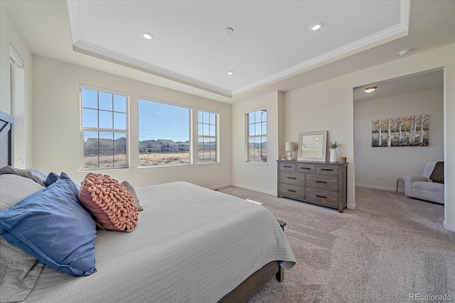 bedroom featuring light carpet, a raised ceiling, baseboards, and ornamental molding