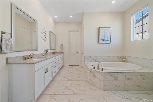 bathroom featuring double vanity, recessed lighting, a sink, a garden tub, and marble finish floor