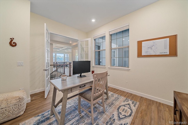 office with recessed lighting, baseboards, and wood finished floors