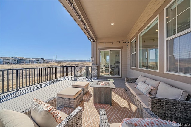 view of patio / terrace with an outdoor living space with a fire pit