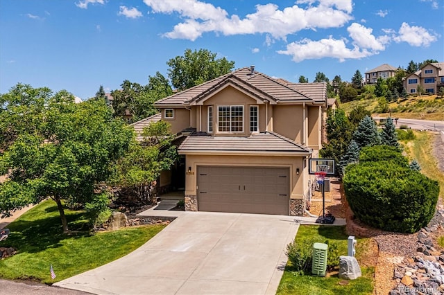 view of front property with a garage and a front yard