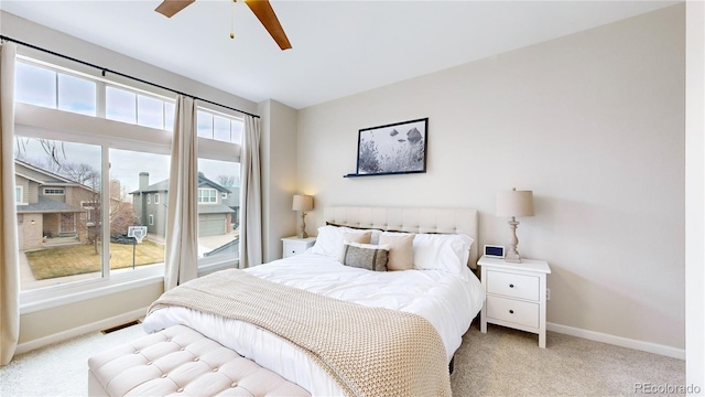 carpeted bedroom with ceiling fan