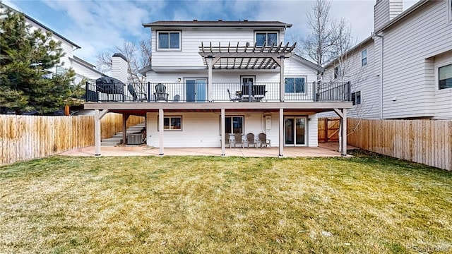 back of house featuring a yard, a patio, and central air condition unit