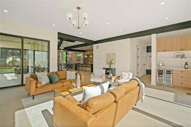 living room featuring indoor bar, wine cooler, and a chandelier