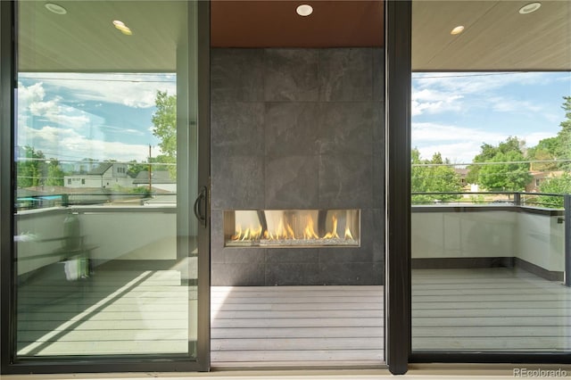 exterior details with a tile fireplace