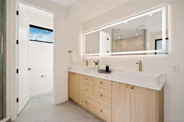 bathroom with walk in shower, tile patterned floors, and vanity