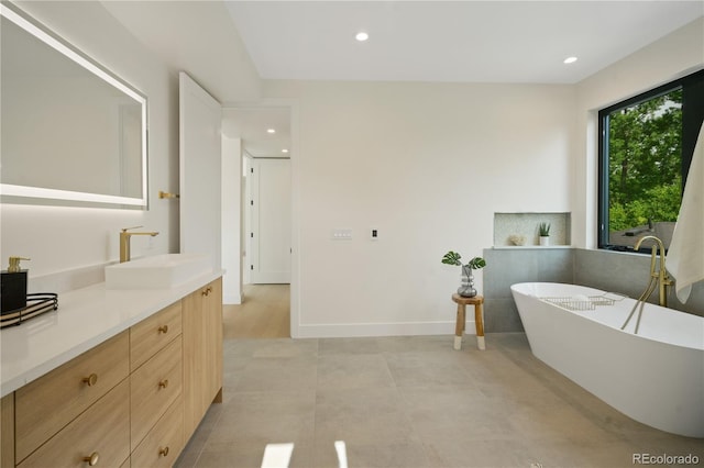 bathroom featuring vanity and a bathtub