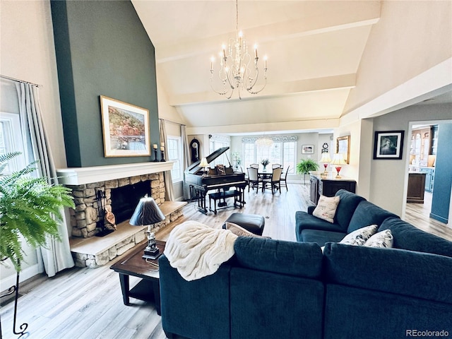 4505 S Yosemite St Unit 102, Denver, CO 80237 - living room featuring a chandelier, light wood-type flooring, and high vaulted ceiling