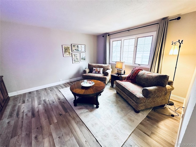 4505 S Yosemite St Unit 102, Denver, CO 80237 - living room with baseboards, a textured ceiling, and wood finished floors