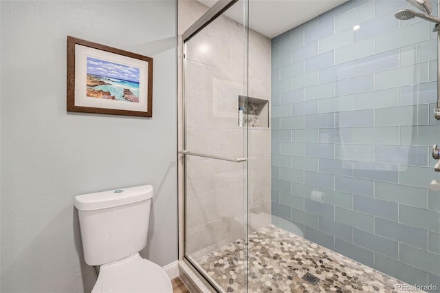 4505 S Yosemite St Unit 102, Denver, CO 80237 - bathroom featuring toilet and a shower stall