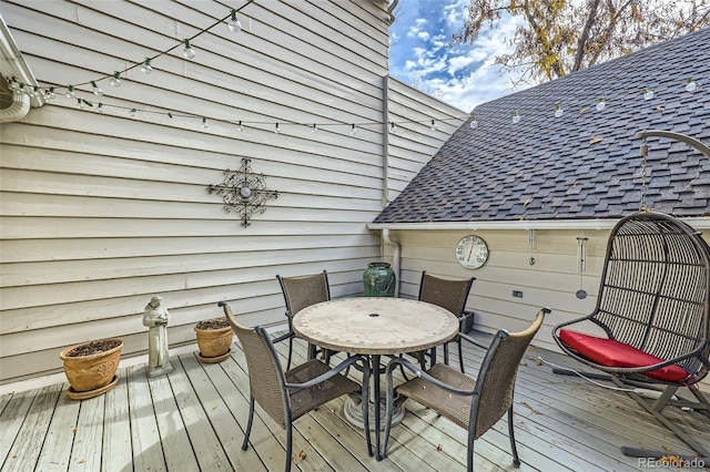 4505 S Yosemite St Unit 102, Denver, CO 80237 - wooden deck featuring outdoor dining space