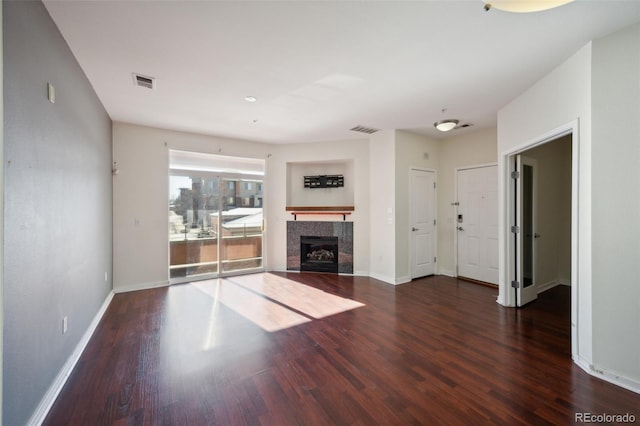 unfurnished living room featuring dark hardwood / wood-style flooring