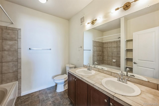 full bathroom featuring vanity, toilet, and tiled shower / bath combo