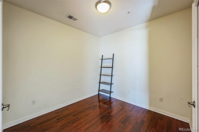 empty room featuring dark hardwood / wood-style floors