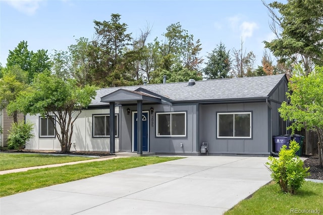 3065 S Eudora St, Denver, CO 80222 - ranch-style house featuring a front yard, a shingled roof, and driveway