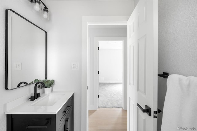 3065 S Eudora St, Denver, CO 80222 - bathroom featuring vanity and wood finished floors