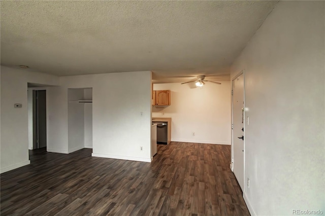 10211 Ura Ln Unit 9-308, Thornton, CO 80260 - unfurnished living room featuring dark wood-style flooring, a ceiling fan, and a textured ceiling