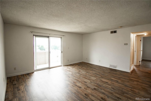 10211 Ura Ln Unit 9-308, Thornton, CO 80260 - spare room with dark wood-type flooring and a textured ceiling