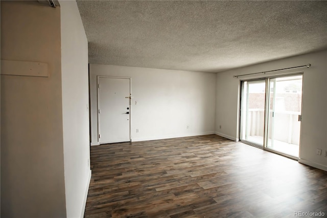 10211 Ura Ln Unit 9-308, Thornton, CO 80260 - empty room featuring dark wood finished floors and a textured ceiling