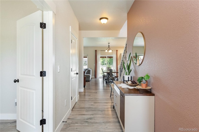101 Wake St, Frederick, CO 80530 - hallway with light wood-style flooring and baseboards