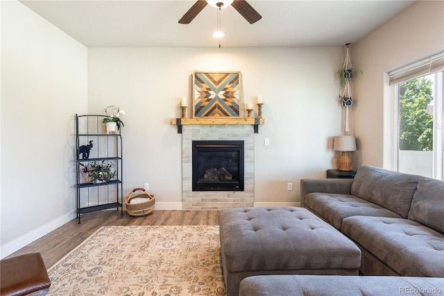 101 Wake St, Frederick, CO 80530 - living area featuring ceiling fan, wood finished floors, and a glass covered fireplace