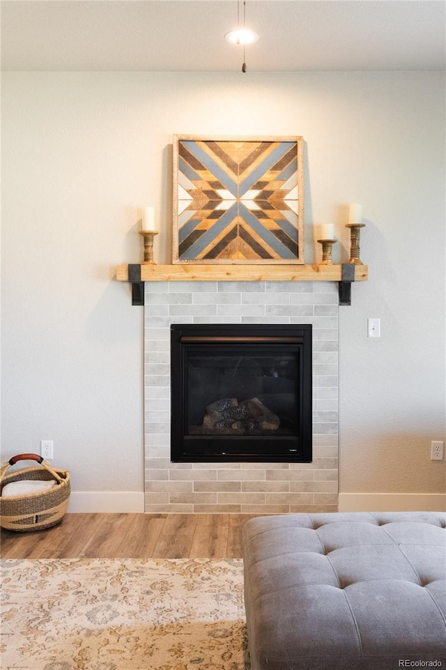 101 Wake St, Frederick, CO 80530 - detailed view of wood finished floors and a brick fireplace