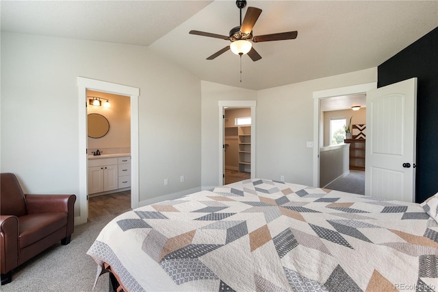 101 Wake St, Frederick, CO 80530 - bedroom featuring lofted ceiling, carpet flooring, a walk in closet, ensuite bathroom, and ceiling fan