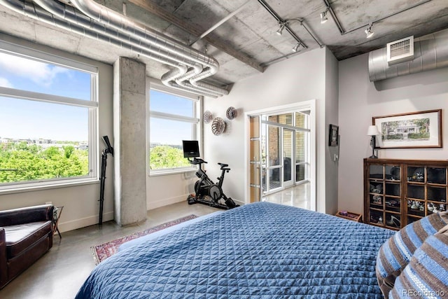 1610 Little Raven St Unit 302, Denver, CO 80202 - bedroom featuring concrete flooring, baseboards, and rail lighting