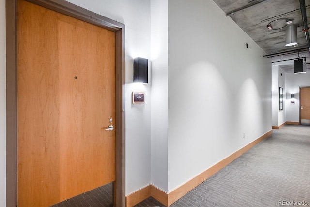 1610 Little Raven St Unit 302, Denver, CO 80202 - hallway featuring carpet flooring and baseboards
