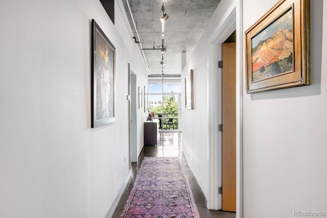 1610 Little Raven St Unit 302, Denver, CO 80202 - corridor with rail lighting and baseboards