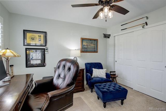 sitting room featuring carpet floors and ceiling fan