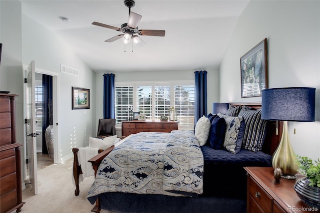 bedroom with baseboards, visible vents, a ceiling fan, light colored carpet, and lofted ceiling