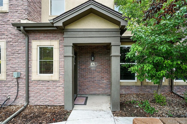 681 W Burgundy St Unit A, Highlands Ranch, CO 80129 - doorway to property with brick siding
