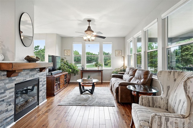 681 W Burgundy St Unit A, Highlands Ranch, CO 80129 - living area featuring plenty of natural light, a ceiling fan, and hardwood / wood-style floors