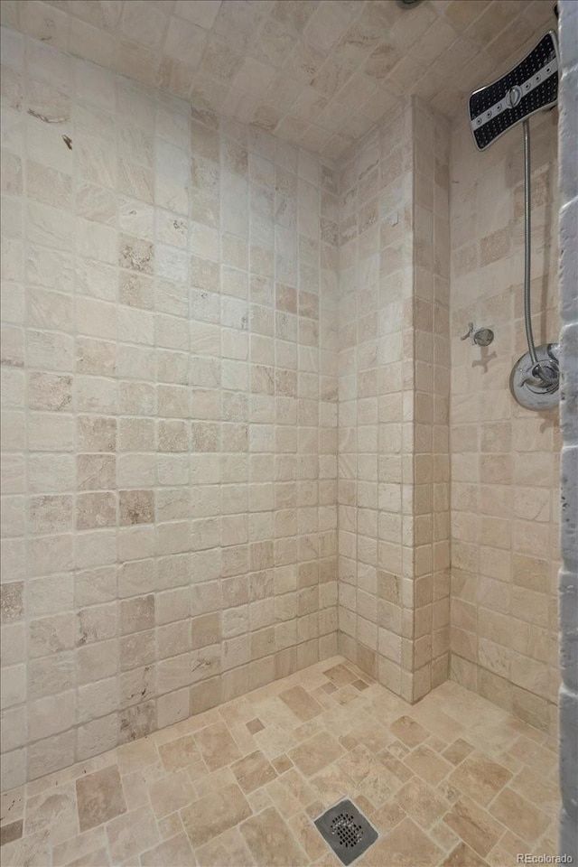 bathroom with a tile shower