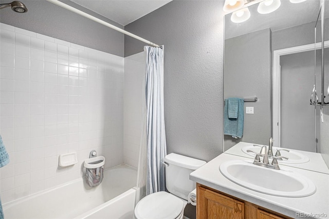 3543 S Ceylon Way, Aurora, CO 80013 - full bath with a textured wall, shower / bathtub combination with curtain, toilet, and vanity