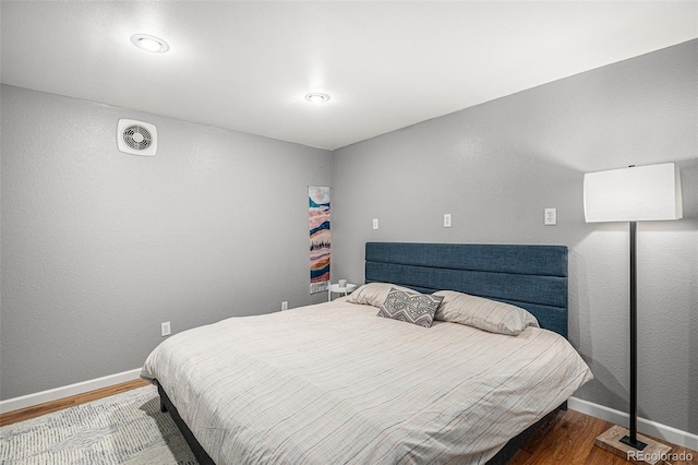 3543 S Ceylon Way, Aurora, CO 80013 - bedroom featuring wood finished floors and baseboards