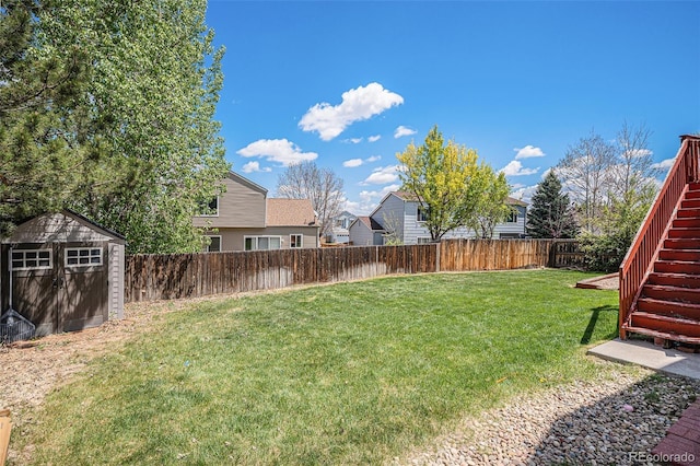 3543 S Ceylon Way, Aurora, CO 80013 - view of yard featuring stairway, a storage shed, and an outdoor structure