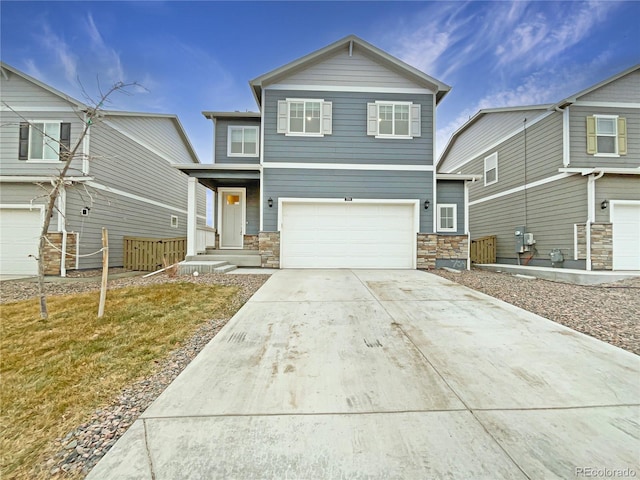 front facade featuring a garage and a front yard