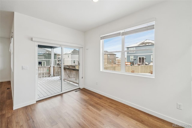 unfurnished room featuring wood-type flooring