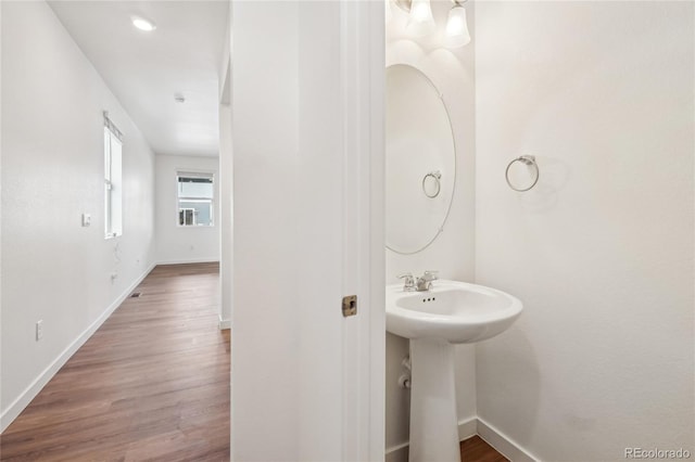 bathroom featuring sink and hardwood / wood-style floors