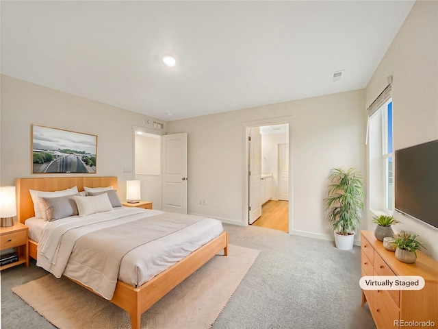 carpeted bedroom with ensuite bathroom