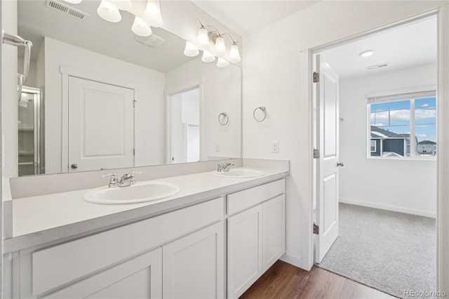 bathroom featuring vanity and hardwood / wood-style floors